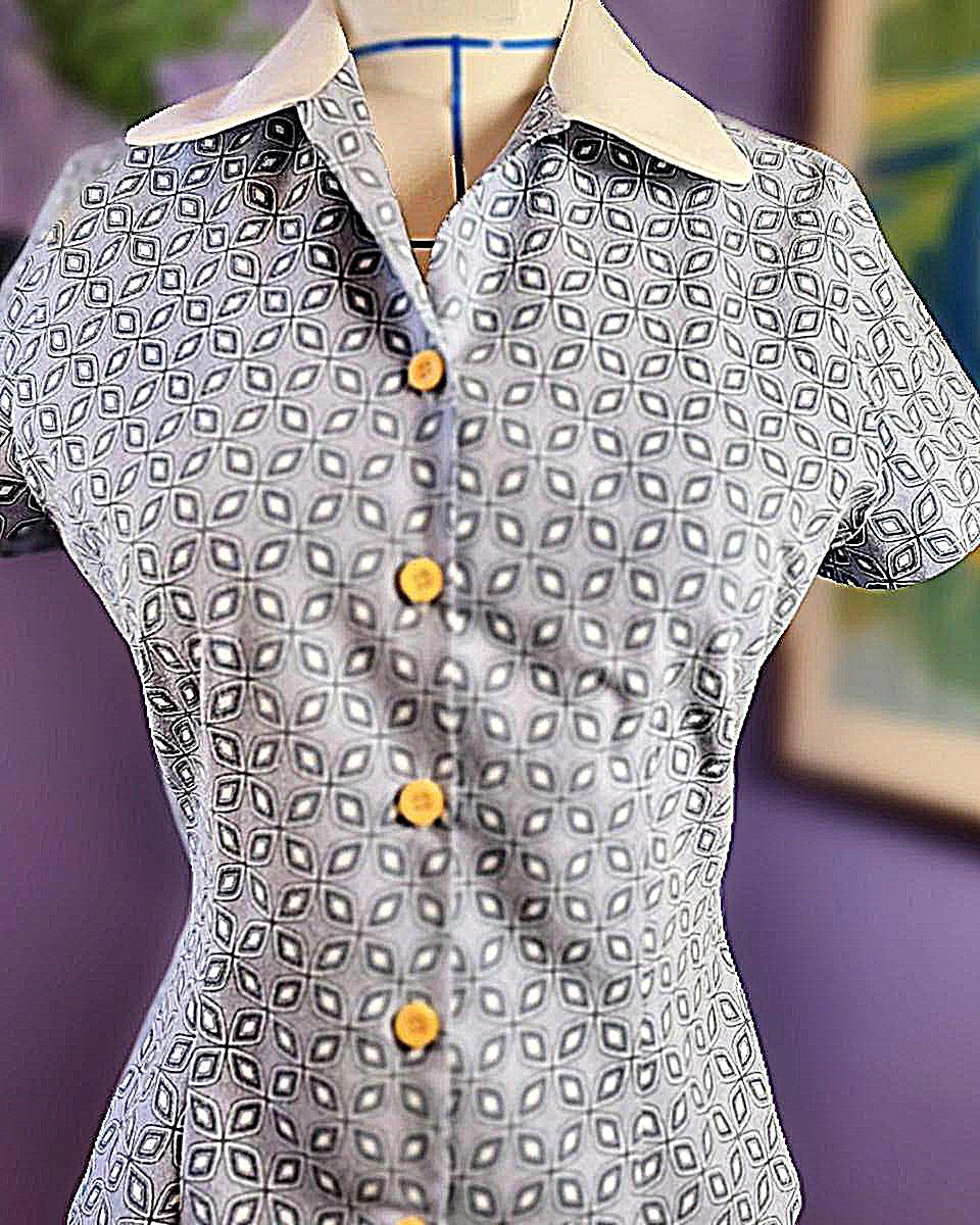 image of short sleeve woman's shirt with white collar and 5 yellow buttons