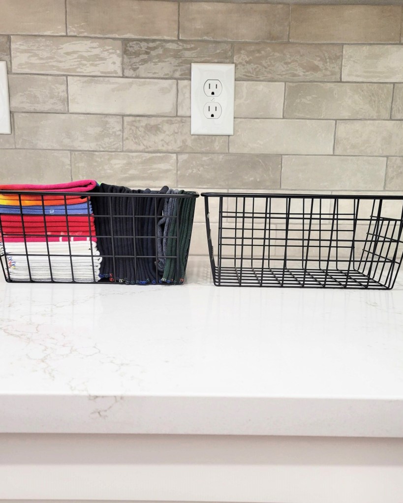 photo of smart cloth towels in left wire bin and empty bin on right side for dirty smart towels