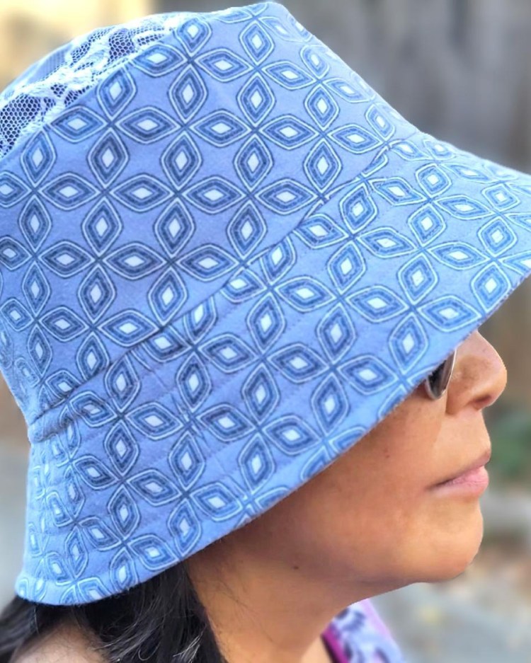 photo of bucket hat with sky blue and white geometric shapes