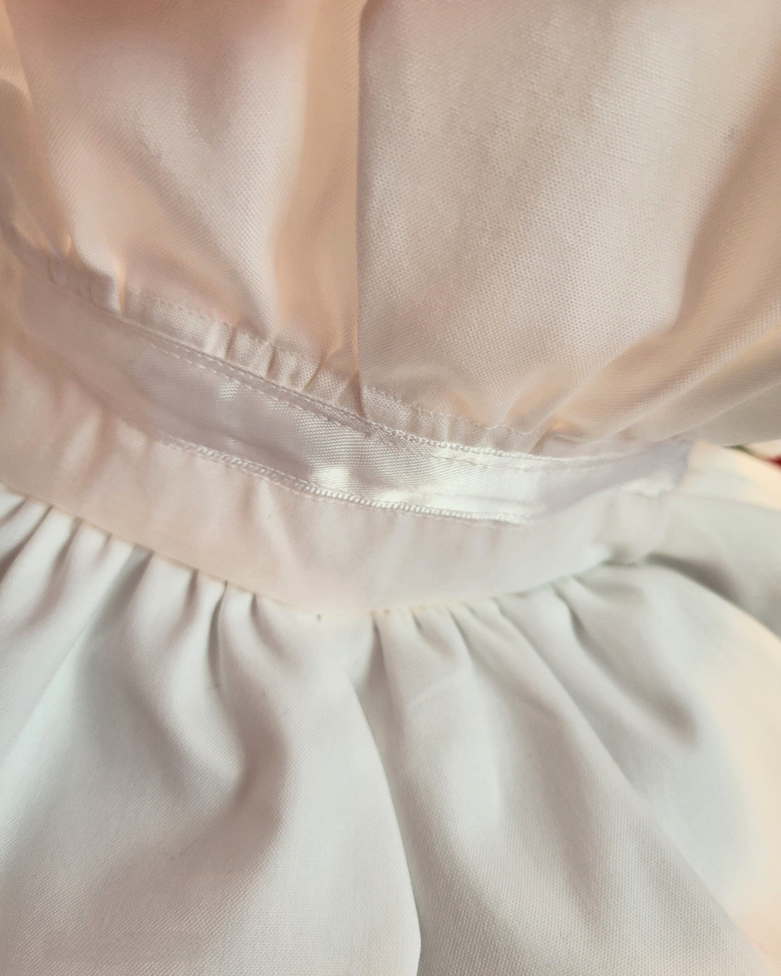 close-up picture of stitching of upcycled men's white shirt at urbanhandmades.com