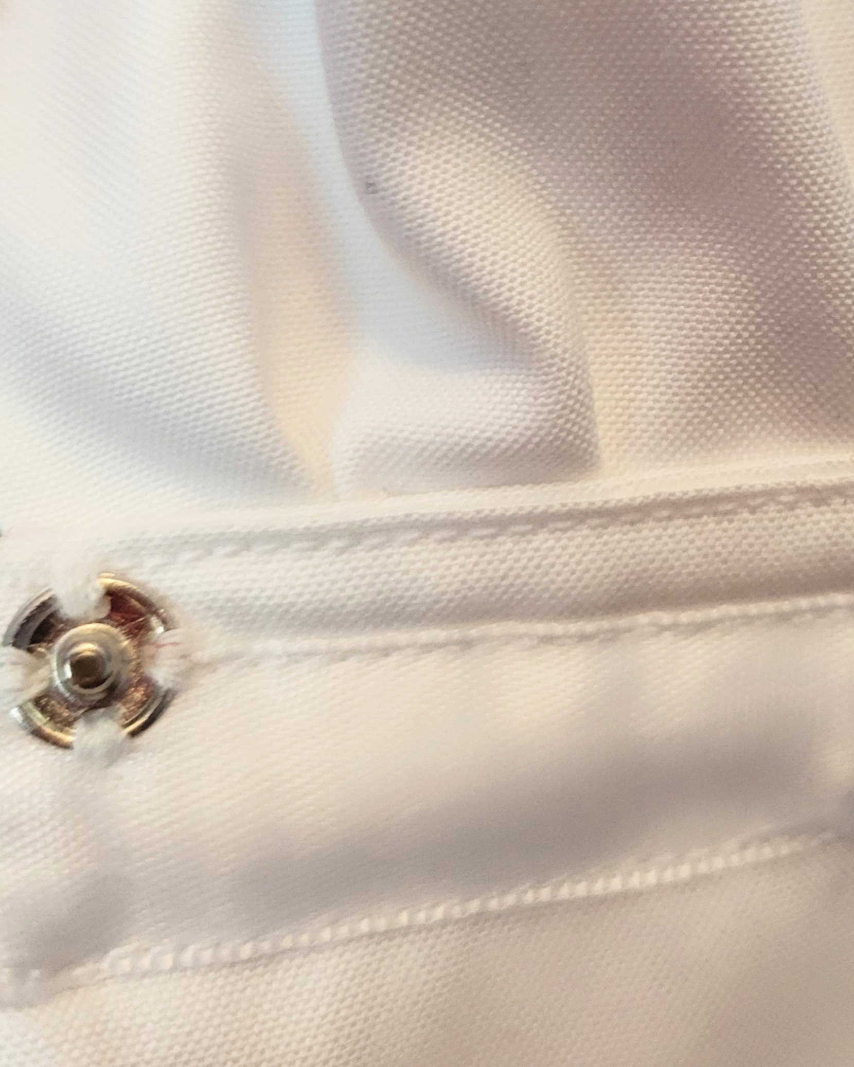 close-up of stitching and sewing of repurposed men's white shirt into 1920s vintage inspired petal collar