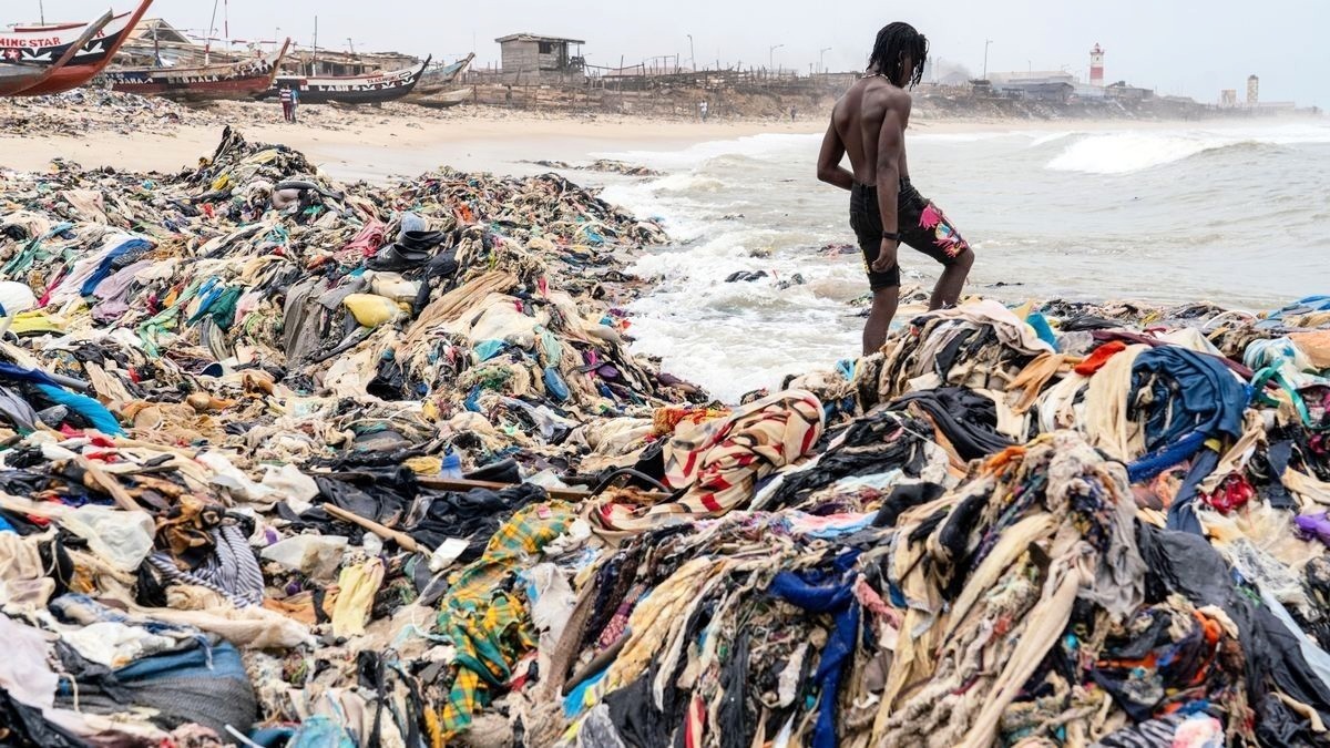 image of textile waste pollution washed ashore on beaches of Ghana