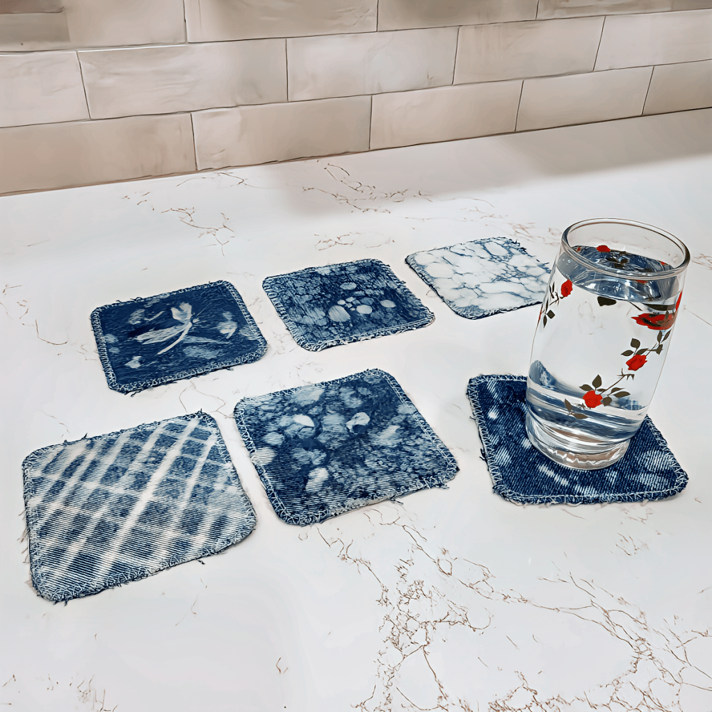 denim pants repurposed to coasters with bleach painted abstract designs