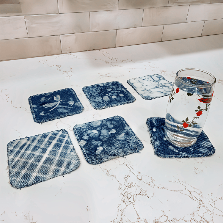 denim pants repurposed to coasters with bleach painted abstract designs
