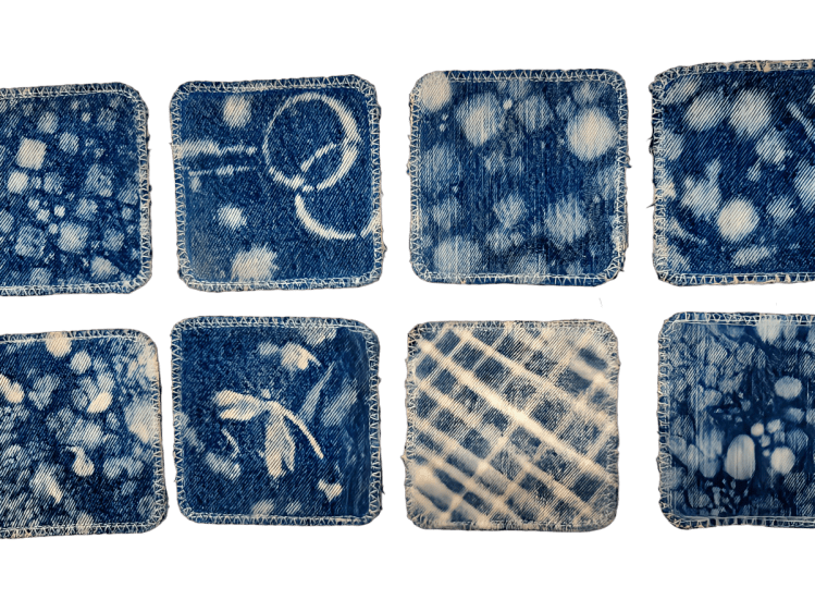 photo of 8 upcycled denim coasters with bleach painting in abstracts designs