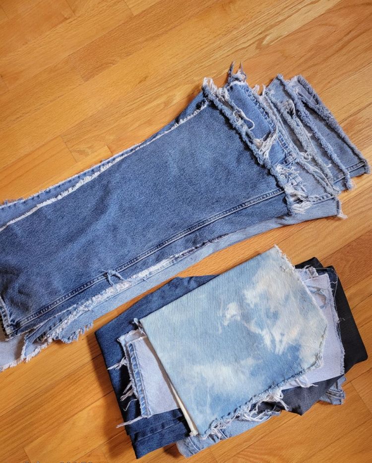 photo of pile of deconstructed denim jeans waiting for upcycling repurpose sustainable products