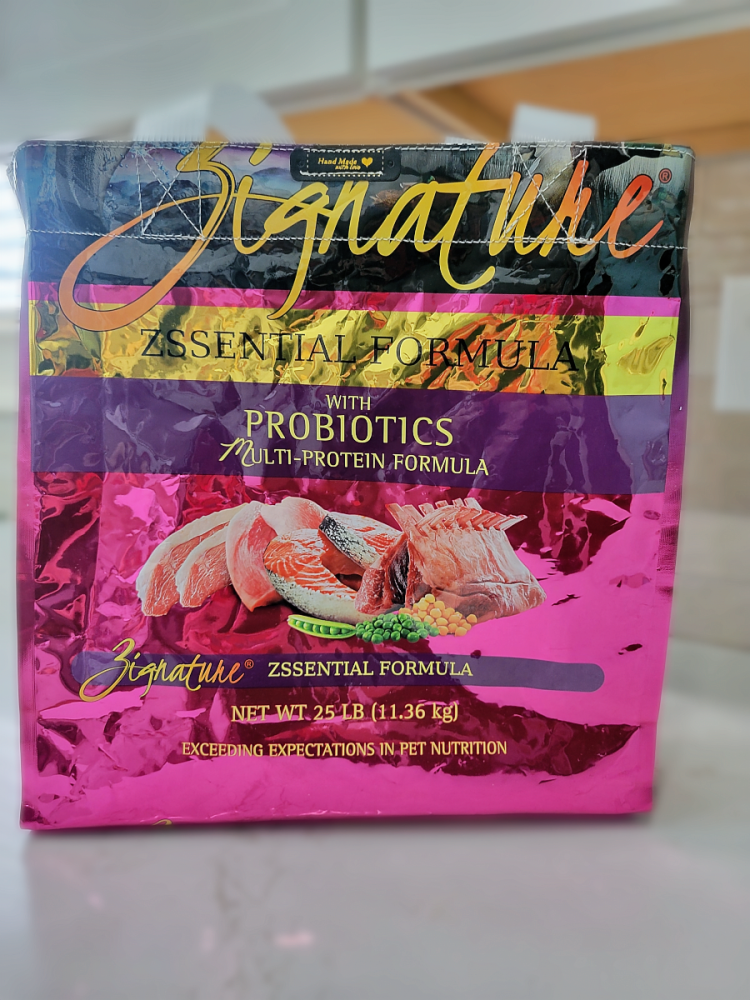 Zignature dog food bag repurposed into reusable shopping bag in bright pink color with label 'handmade with love' for the earth